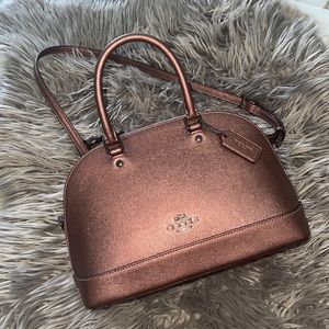 Coach/original MINI SIERRA SATCHEL it’s a pinkish purple color, very different